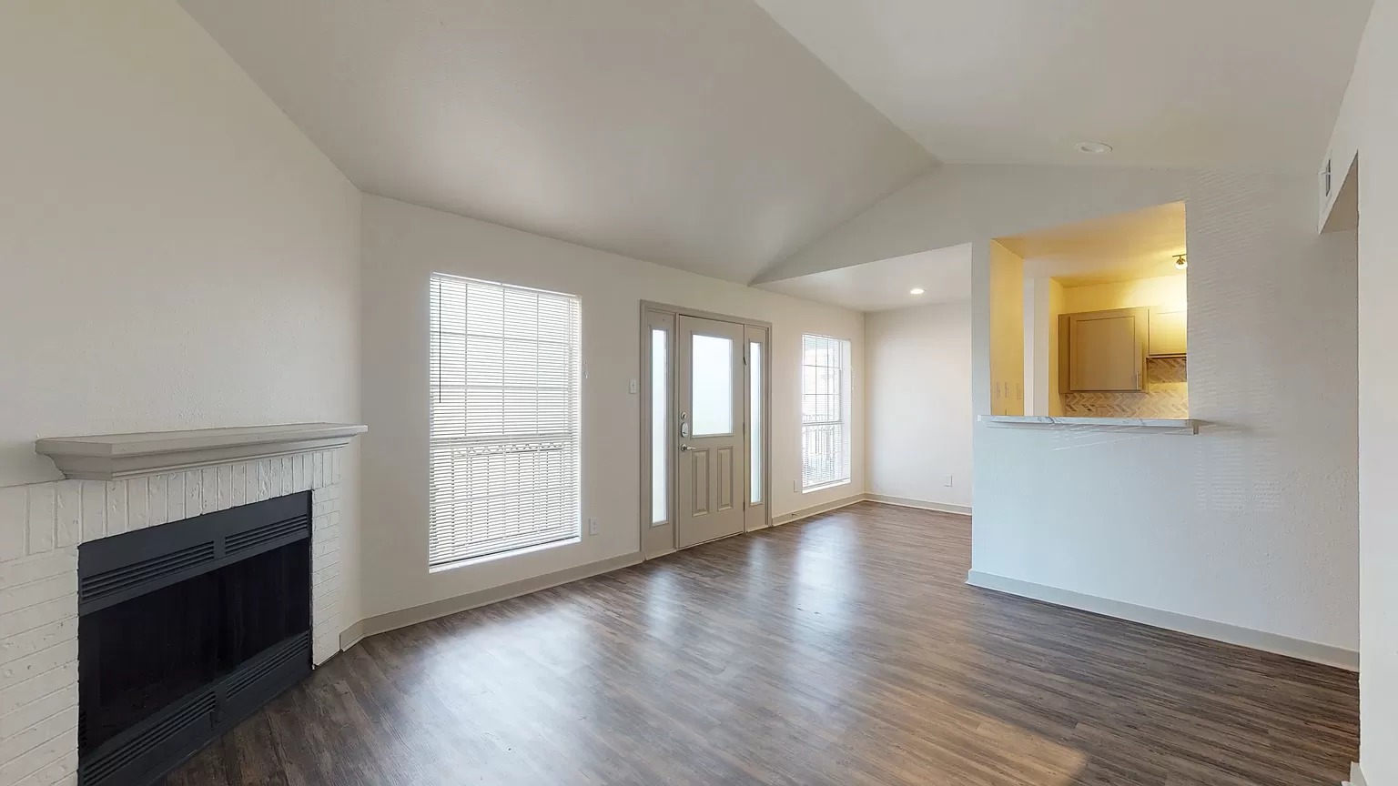 Spacious living room with a fireplace in a renovated 1540 home